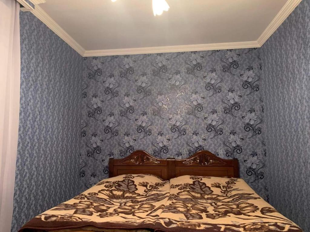 Postel nebo postele na pokoji v ubytování Guest house Mzia