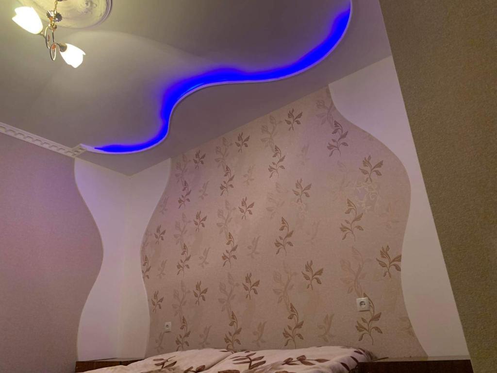 Postel nebo postele na pokoji v ubytování Guest house Mzia
