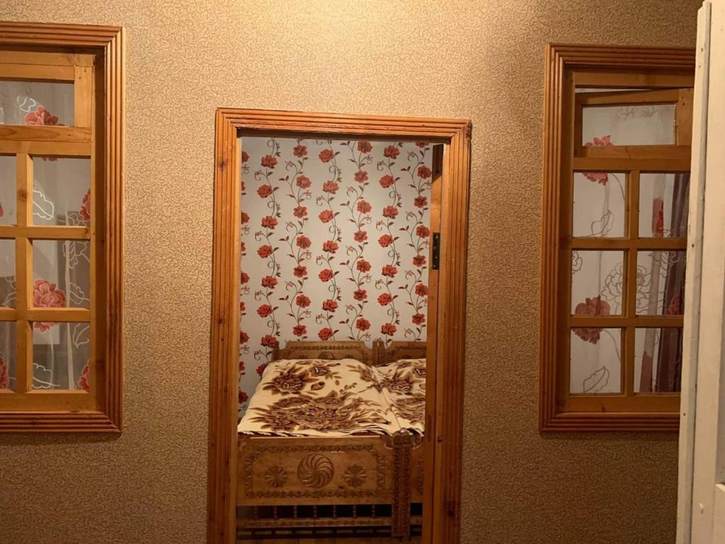 Postel nebo postele na pokoji v ubytování Guest house Mzia