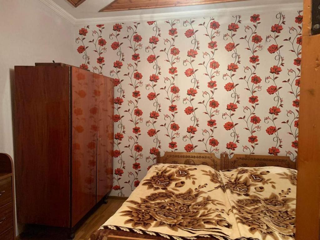 Postel nebo postele na pokoji v ubytování Guest house Mzia