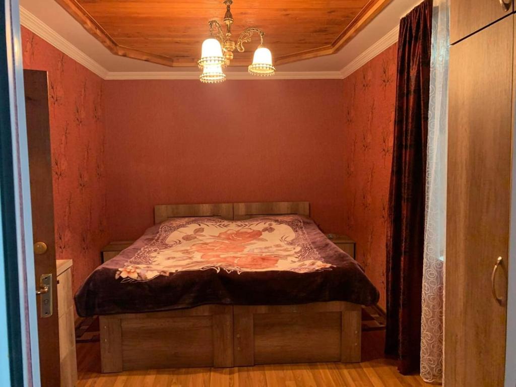 Postel nebo postele na pokoji v ubytování Guest house Mzia