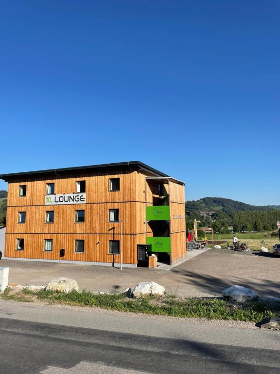 a large building on the side of a road at Motel XL Lounge in Traisen