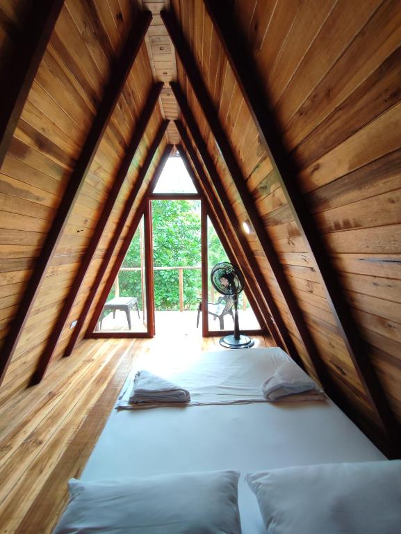 Llit o llits en una habitació de Tiny Houses Unique Tayrona - Dentro del Parque Tayrona