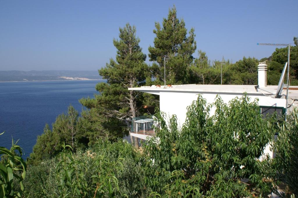 a house with a view of the water at Apartments by the sea Marusici, Omis - 2741 in Mimice