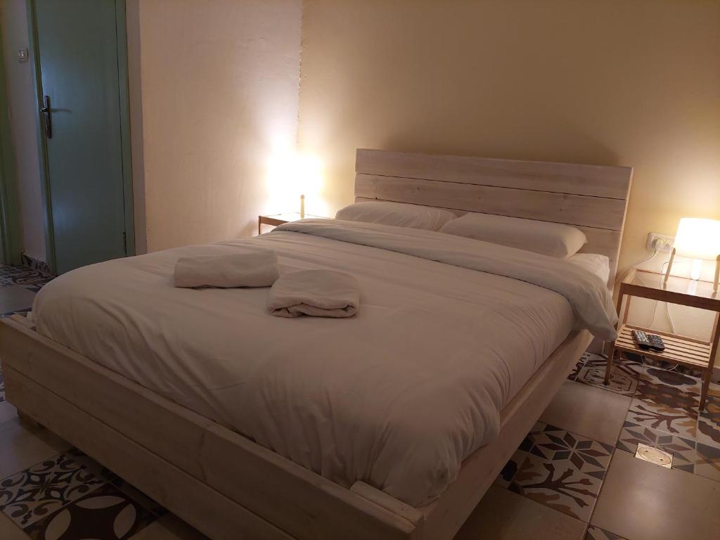 Postel nebo postele na pokoji v ubytování Al Bishara Guest House