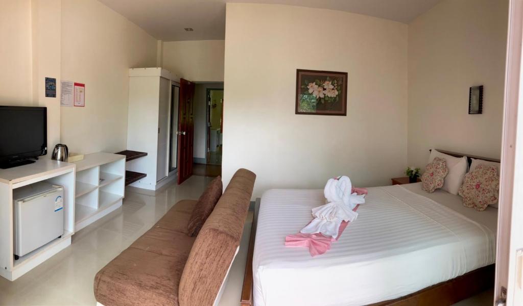 Postel nebo postele na pokoji v ubytování Lanta Just Come Hotel