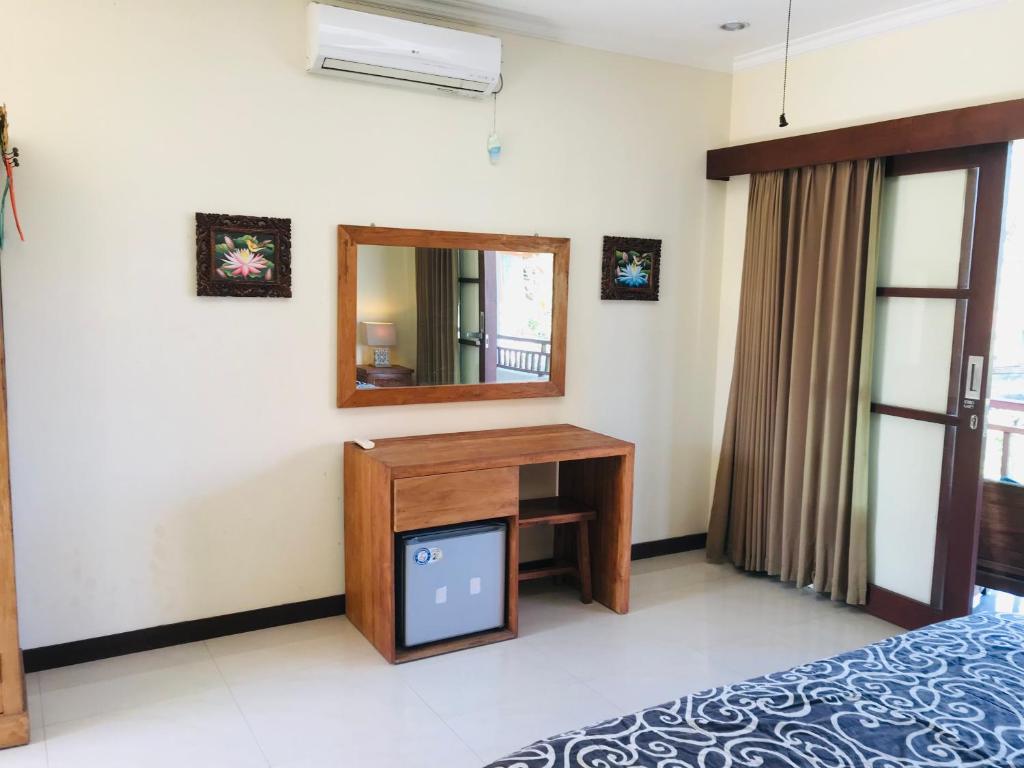Postel nebo postele na pokoji v ubytování Ayu Bisma Homestay