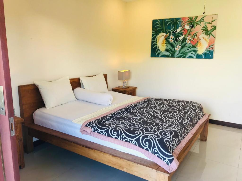 Postel nebo postele na pokoji v ubytování Ayu Bisma Homestay