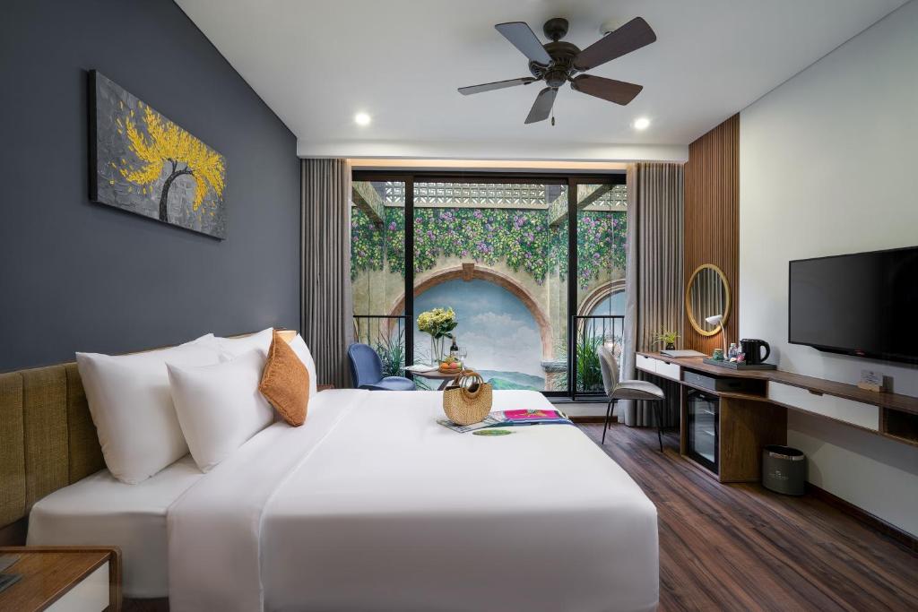 Giường trong phòng chung tại Chi House Danang Hotel and Apartment