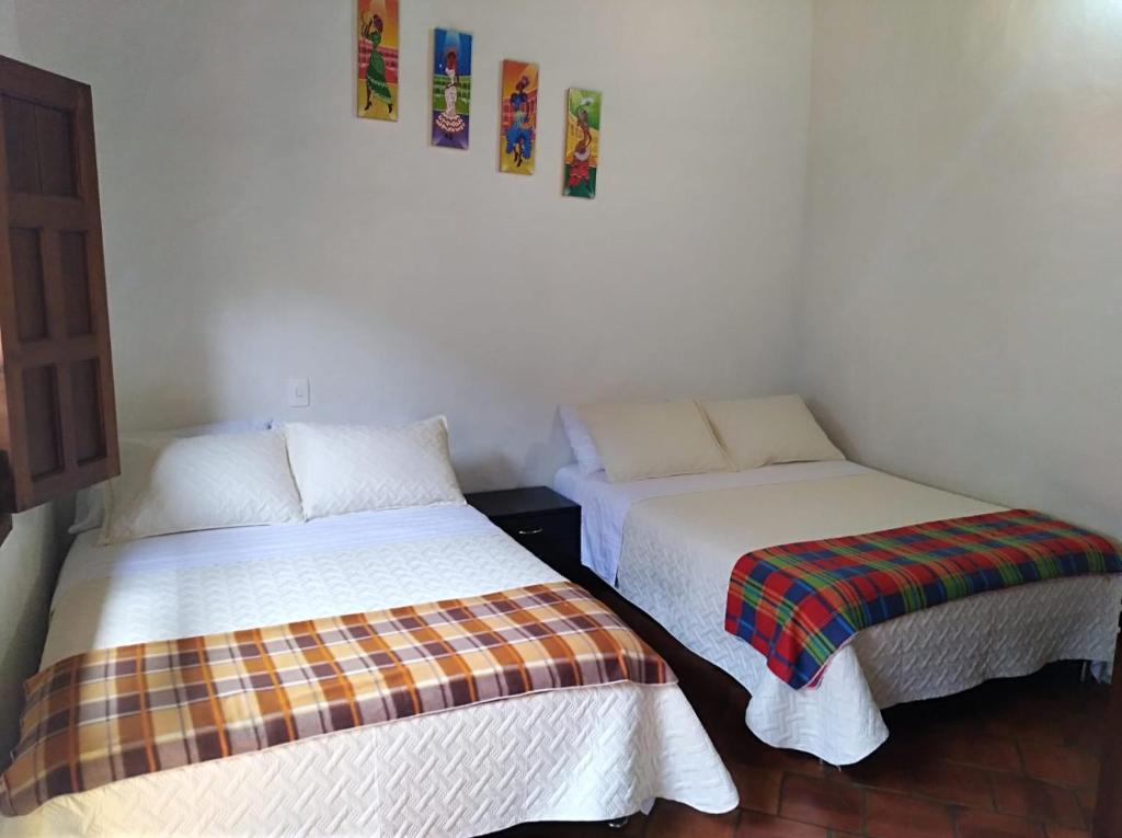 Postel nebo postele na pokoji v ubytování Casa Turistica Barichara