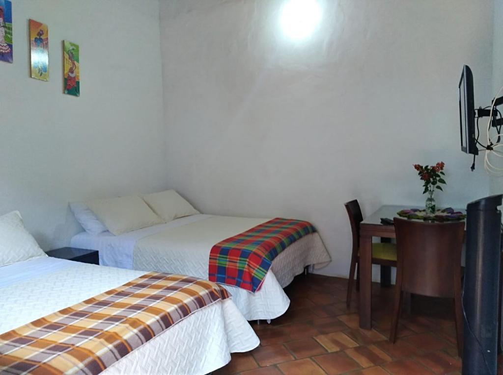 Postel nebo postele na pokoji v ubytování Casa Turistica Barichara