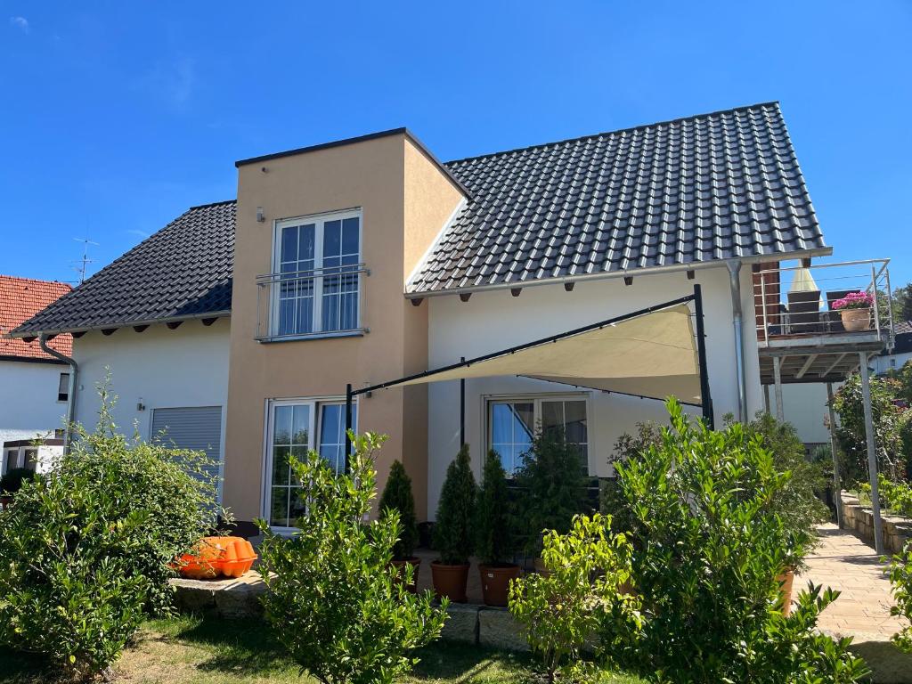 a white house with a roof at Villa Florentine in Bad Liebenstein