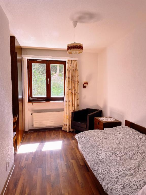 Postel nebo postele na pokoji v ubytování Hotel Gemmi