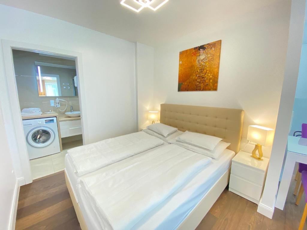 Posteľ alebo postele v izbe v ubytovaní Steiner Residences Vienna Vorgartenstrasse