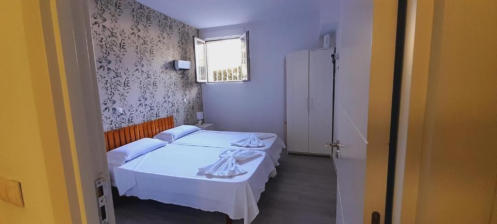 Postel nebo postele na pokoji v ubytování El Colmenar Apartamento