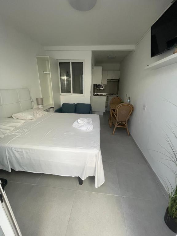 A bed or beds in a room at Apartamentos Elena