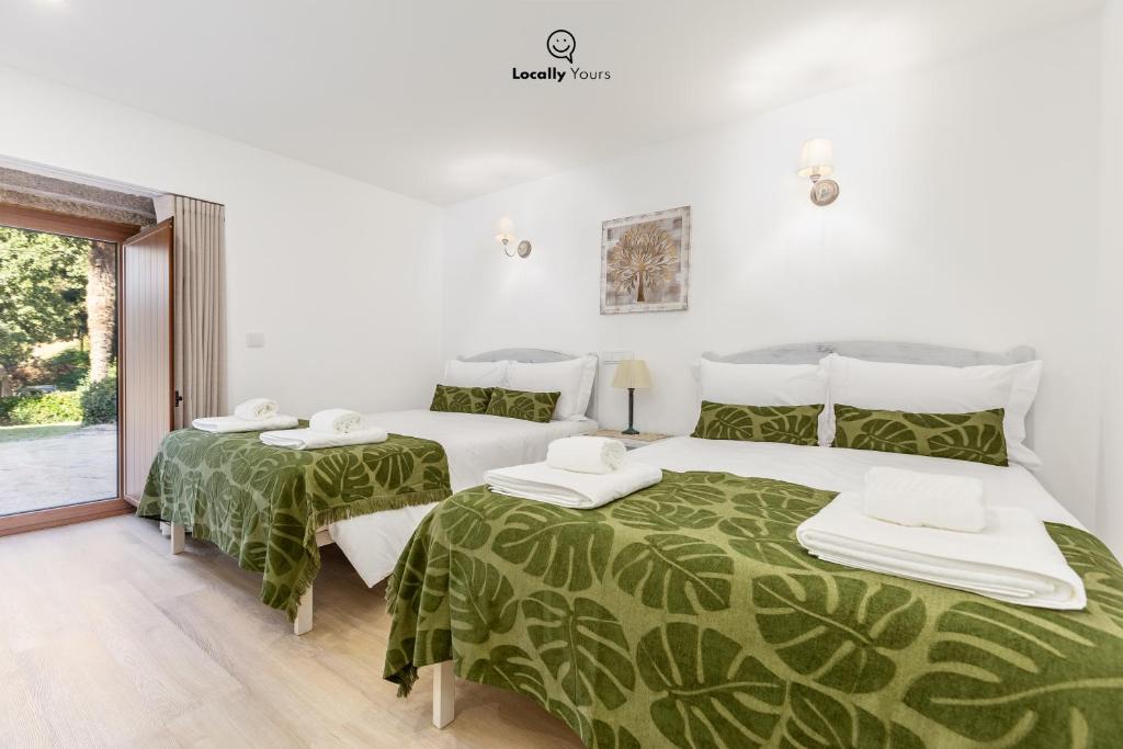 Uma cama ou camas num quarto em Casa do Monte Locally Yours