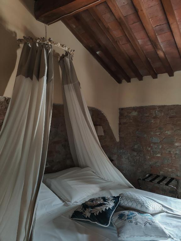 Posteľ alebo postele v izbe v ubytovaní Podere Borgaruccio