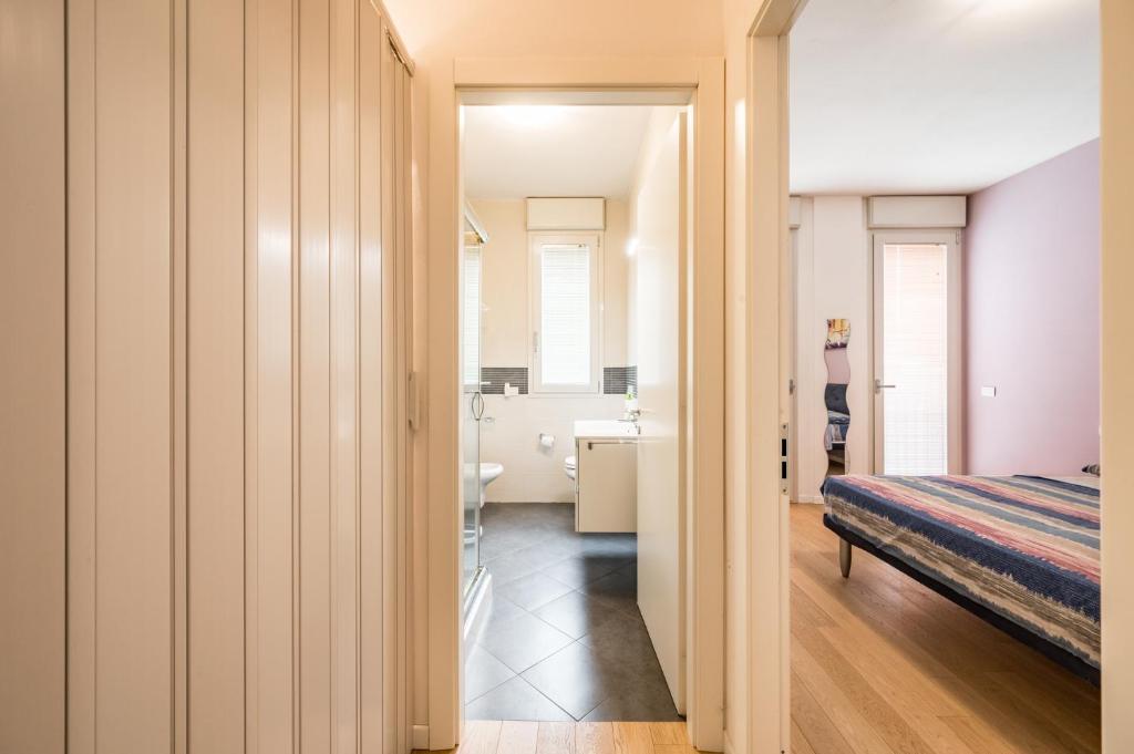 A bed or beds in a room at La Casa di Edo - WiFi Parking free