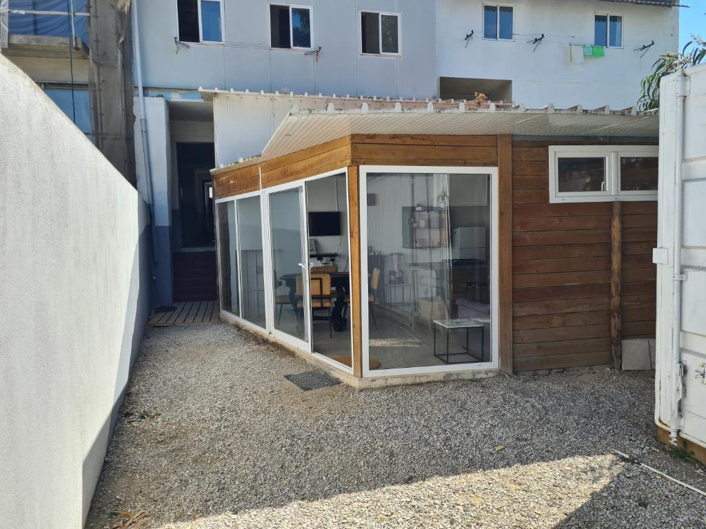 a house with a sliding glass door at Casa Vale Ecotainer in Lisbon