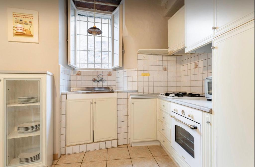 A kitchen or kitchenette at Perugia Historic Center Apartment