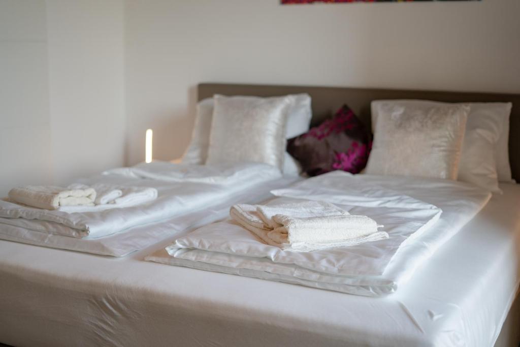Posteľ alebo postele v izbe v ubytovaní Rooms21