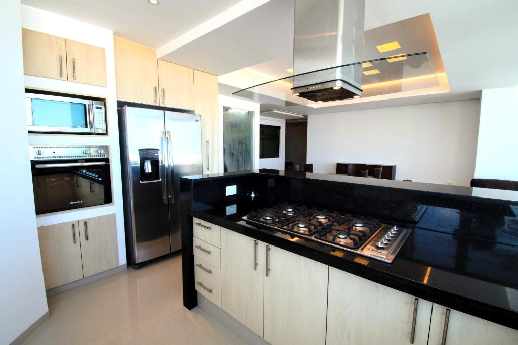 Kuchyň nebo kuchyňský kout v ubytování Terra Residencial
