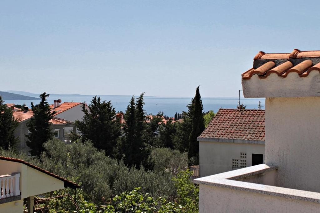 a view of the ocean from the roofs of buildings at Double Room Krk 5294b in Krk
