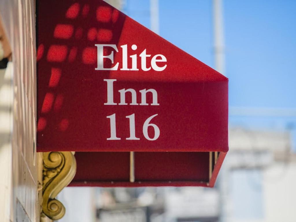 a red sign that reads life im at Elite Inn in San Francisco