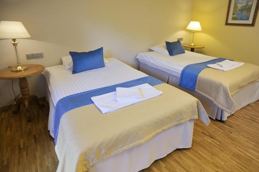 Postel nebo postele na pokoji v ubytování Hotel Mir-Jan SPA
