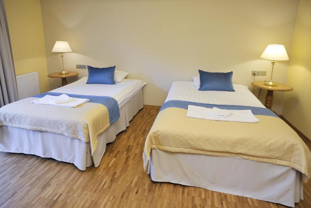 Postel nebo postele na pokoji v ubytování Hotel Mir-Jan SPA