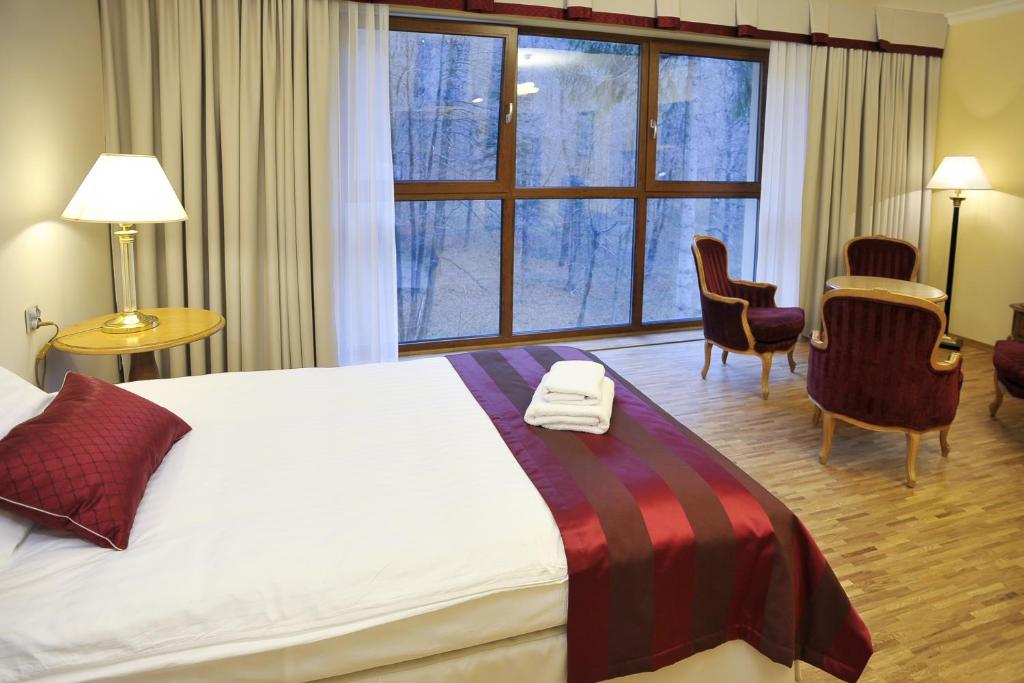 Postel nebo postele na pokoji v ubytování Hotel Mir-Jan SPA