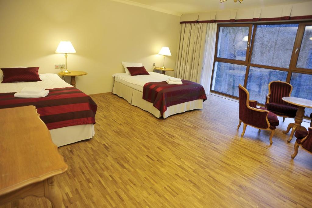 Postel nebo postele na pokoji v ubytování Hotel Mir-Jan SPA
