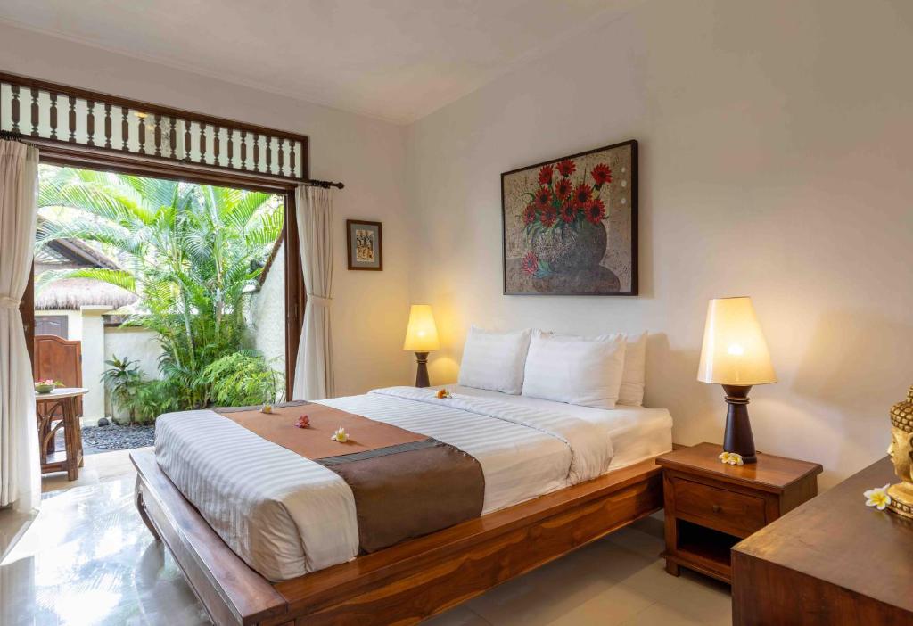 Voodi või voodid majutusasutuse Alam Anda Ocean Front Resort & Spa CHSE Certified toas