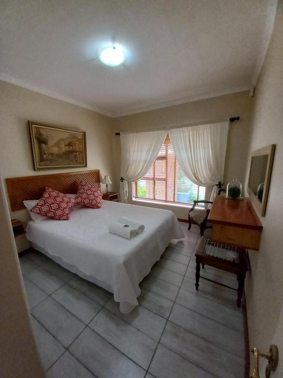 Ένα ή περισσότερα κρεβάτια σε δωμάτιο στο Willow Cottage George