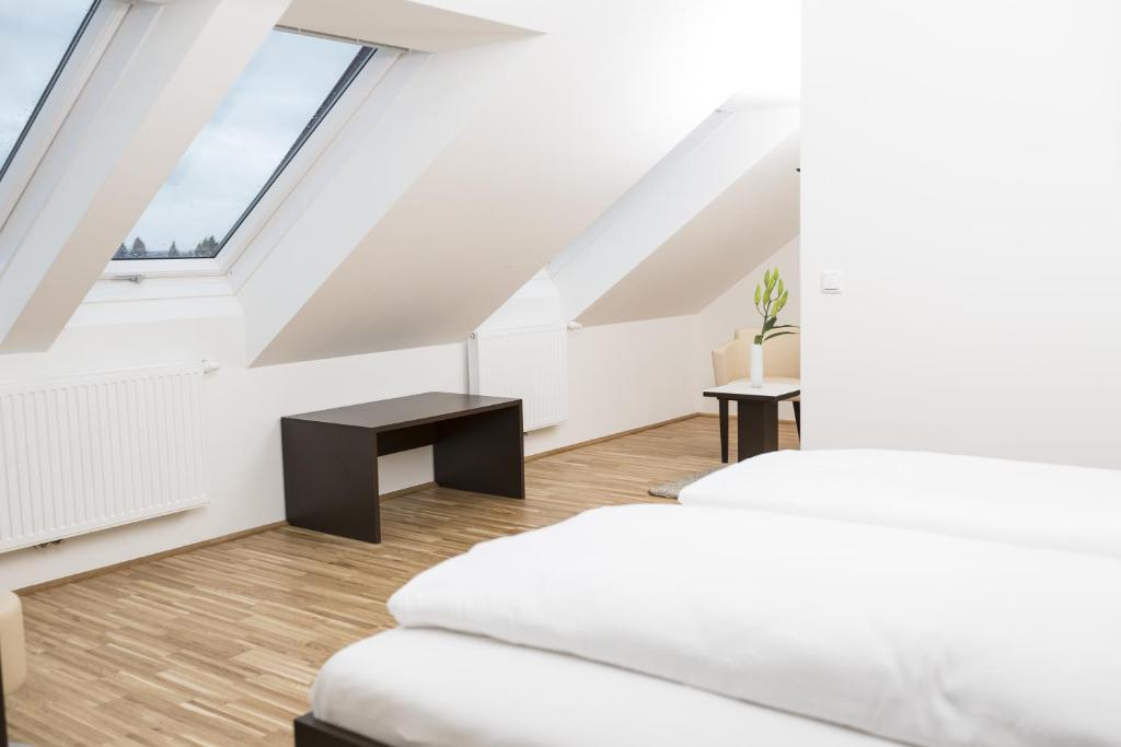 Postel nebo postele na pokoji v ubytování Gästezimmer by Jöchlinger