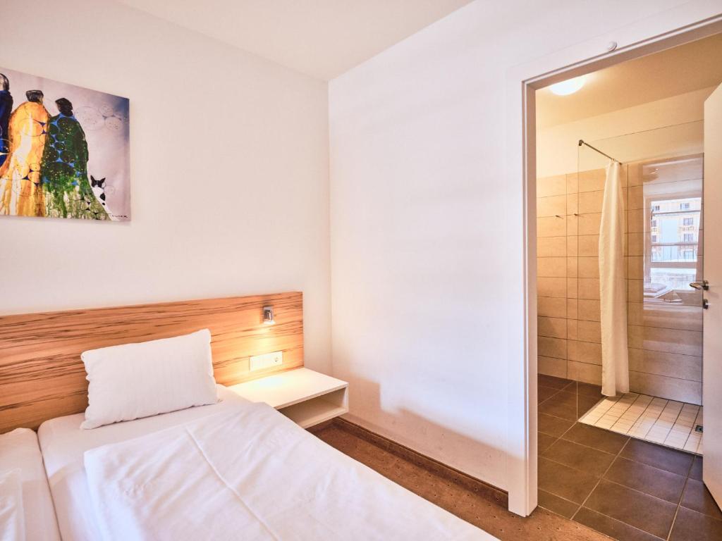 Postel nebo postele na pokoji v ubytování Grafenberg Resort by Alpeffect Hotels