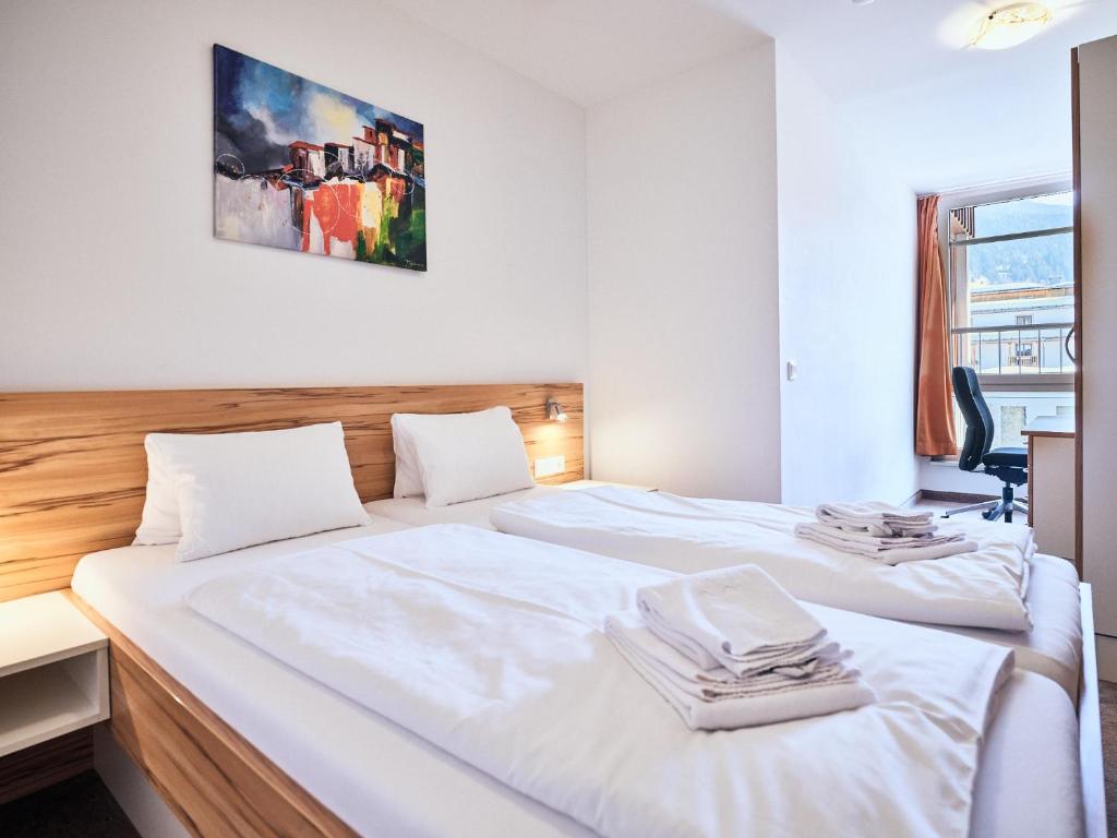 Postel nebo postele na pokoji v ubytování Grafenberg Resort by Alpeffect Hotels