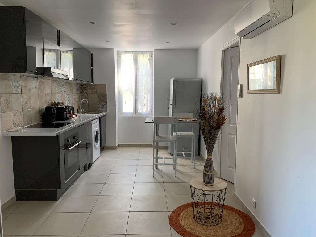 a kitchen with a sink and a counter top at L'Almanarre in Hyères