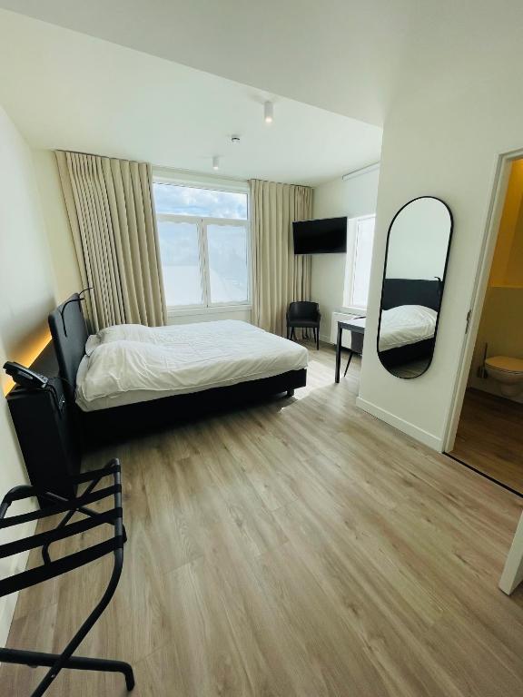Postel nebo postele na pokoji v ubytování Hotel Bell-X Kortrijk-Wevelgem