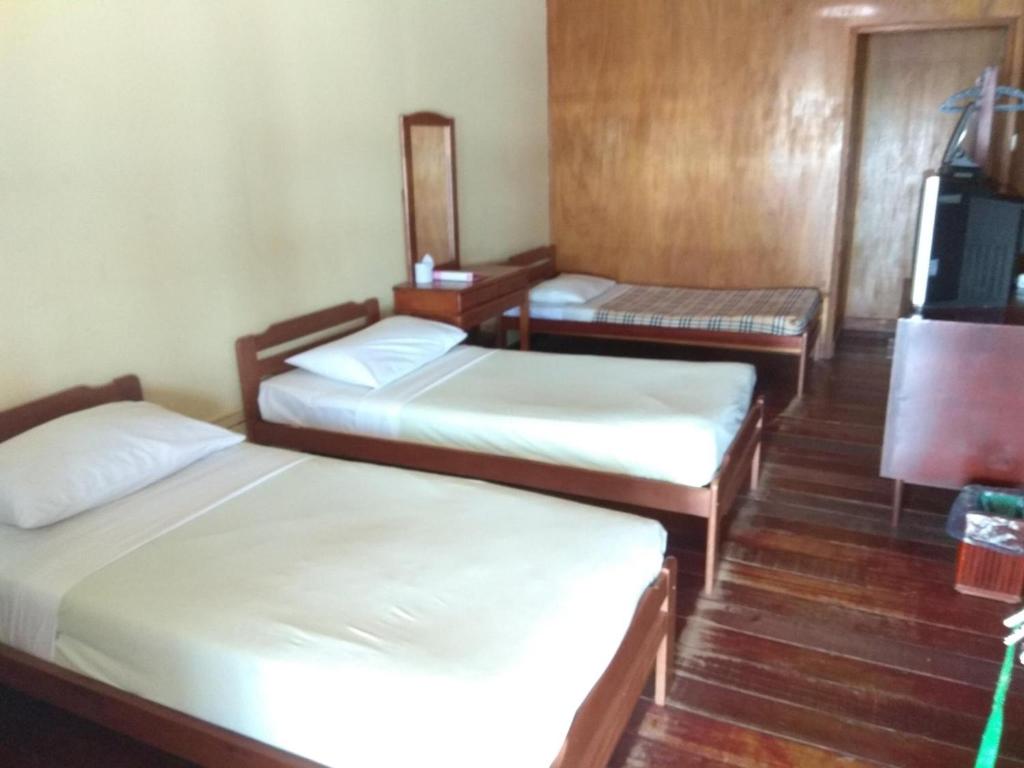 Postel nebo postele na pokoji v ubytování Seaside Travellers Inn