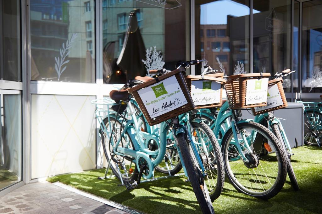 a group of bikes parked in front of a building at ibis Styles Toulon Centre Port in Toulon