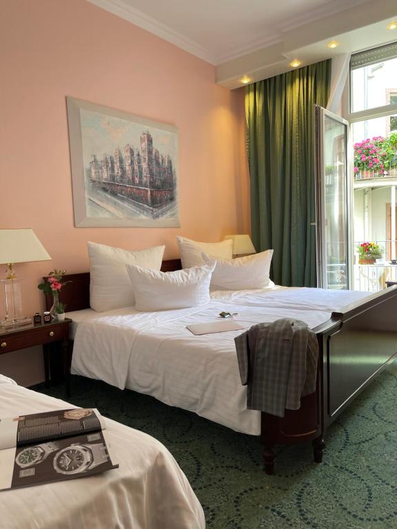 Postel nebo postele na pokoji v ubytování Hotel Palmenhof