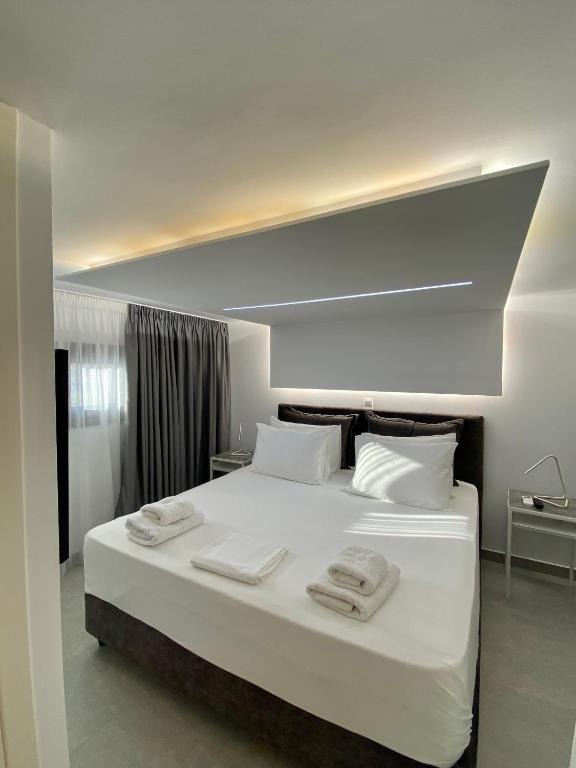 Posteľ alebo postele v izbe v ubytovaní Hotel Alex