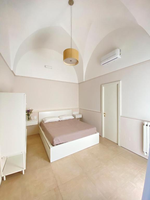 Posteľ alebo postele v izbe v ubytovaní Bottego24 Suite, Apartment & Terrace