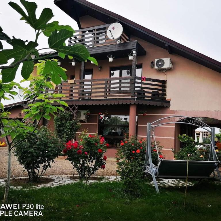 a house with a balcony and a gazebo at Casa Iris Murighiol in Murighiol