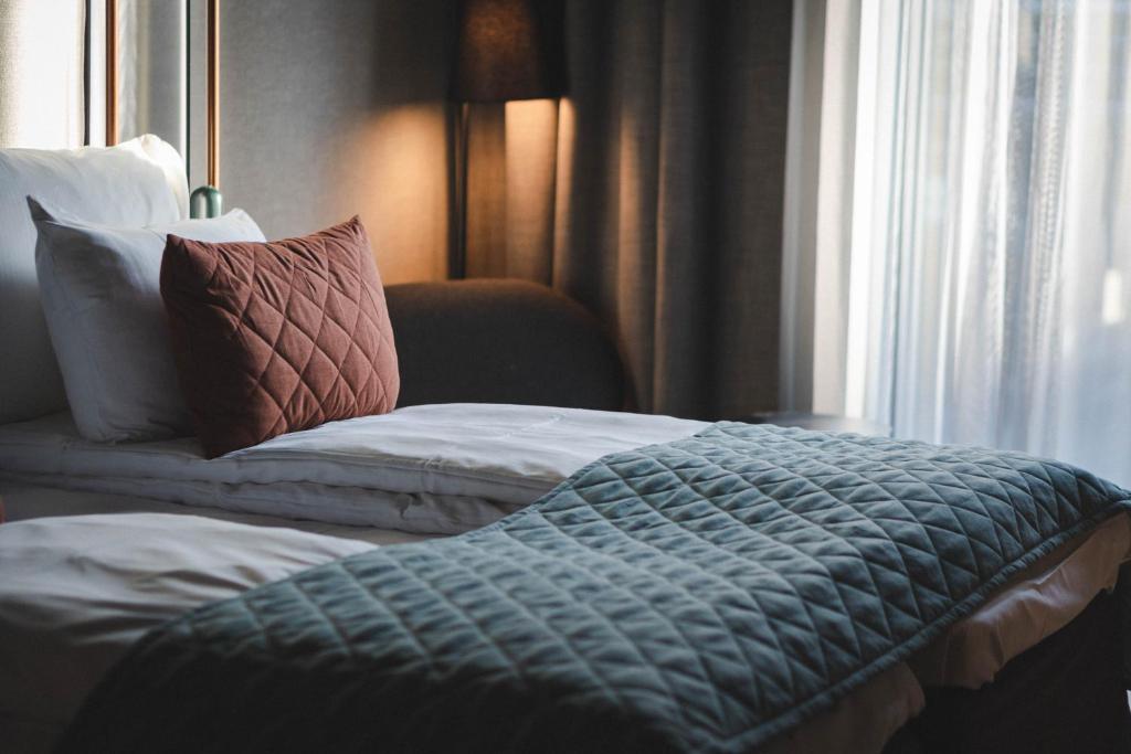 Postel nebo postele na pokoji v ubytování Quality Hotel Hasle Linie