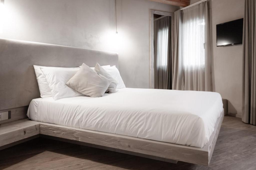 Posteľ alebo postele v izbe v ubytovaní Locanda MaMaGiò