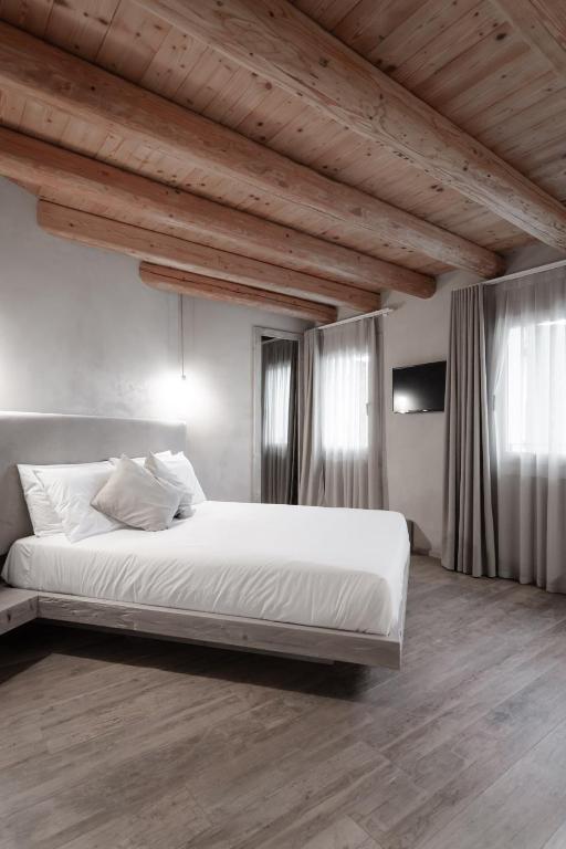 Posteľ alebo postele v izbe v ubytovaní Locanda MaMaGiò