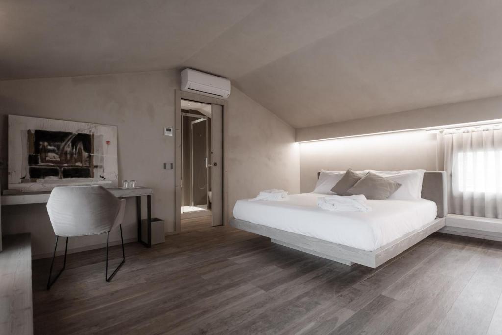 Posteľ alebo postele v izbe v ubytovaní Locanda MaMaGiò